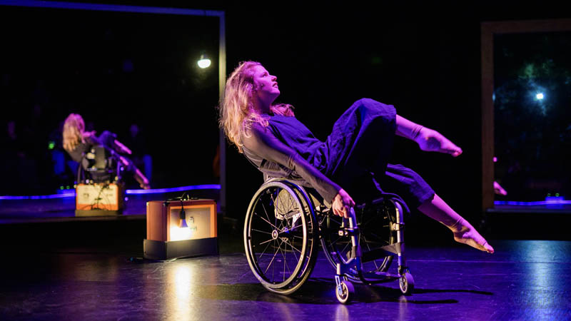 Alisha McLennan Marler performs in White Noise, seated in her wheelchair